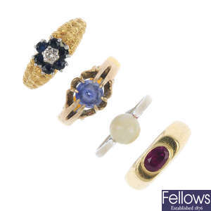 A selection of four gem-set rings. 