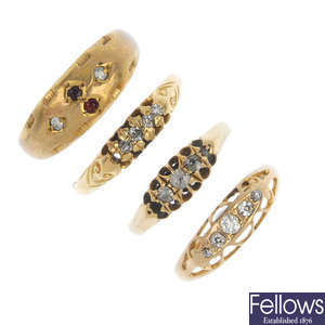 A selection of four early and mid 20th century 18ct gold diamond rings.