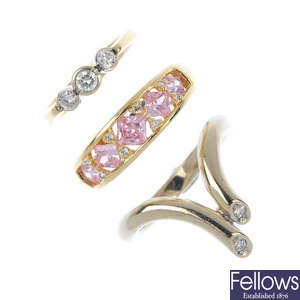 A selection of three 14ct gold diamond and cubic zirconia rings.