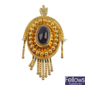 A late 19th century gold foil-back garnet pendant.