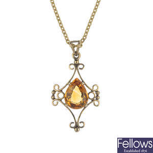 A citrine pendant, with chain.