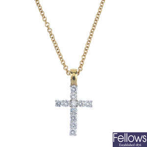 An 18ct gold diamond cross with chain.