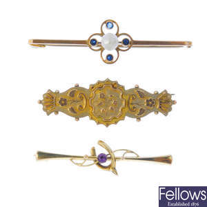 Five late 19th to early 20th century gold brooches.