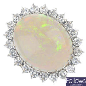 An 18ct gold opal and diamond cluster ring. 