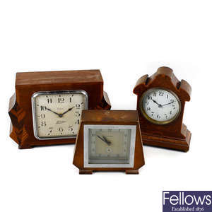 A box containing assorted clocks