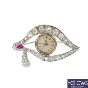 A mid 20th century diamond and synthetic ruby watch brooch.