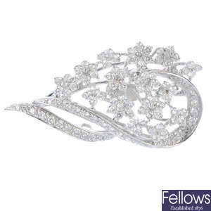 An 18ct gold diamond floral brooch.