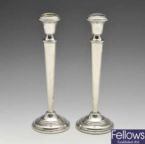 A pair of Egyptian silver candlesticks.