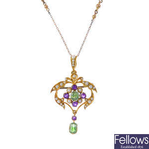 An early 20th century 15ct gold demantoid garnet, amethyst and split pearl pendant, with chain.