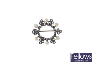 A late 19th century silver and gold, diamond and seed pearl wreath brooch.
