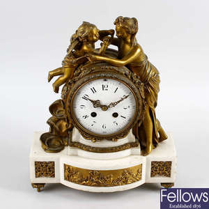 An early to mid 19th century French ormolu and white marble mantel clock