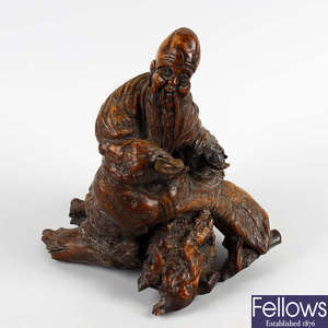  A 19th century Oriental carved rootwood figure