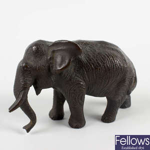  A small cast bronze figure of an elephant