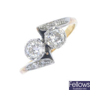 A mid 20th century 18ct gold and platinum diamond two-stone ring.
