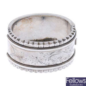 Two late 19th century silver hinged bangles.