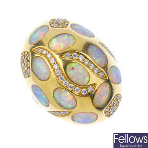 A synthetic opal and diamond dress ring.