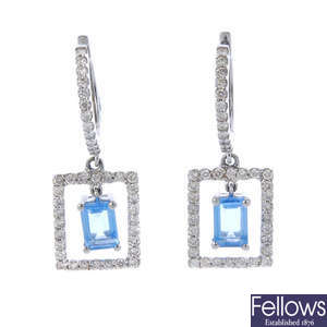A pair of topaz and diamond ear pendants.