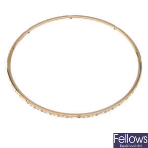 THEO FENNELL - an 18ct gold diamond bangle.