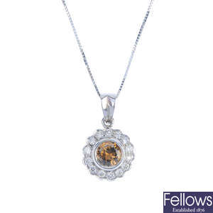 An 18ct gold 'brown' diamond and diamond cluster pendant, with chain.