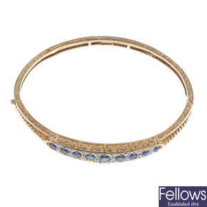 A 9ct gold sapphire and diamond hinged bangle.