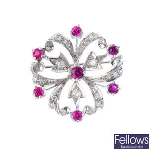A gold ruby and diamond brooch.