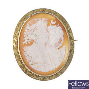 A shell cameo brooch depicting Night and Day.