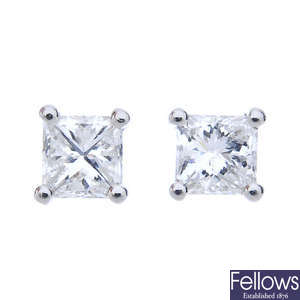 A pair of platinum square-shape diamond ear studs