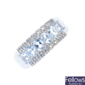 A 9ct gold aquamarine and diamond dress ring.