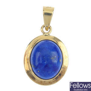 A pair of dyed lapis lazuli earrings and pendant set.