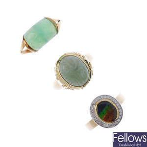 A selection of three gold gem-set rings.