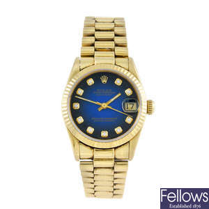 ROLEX - a mid-size 18ct yellow gold Oyster Perpetual Datejust bracelet watch.
