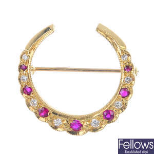 An 18ct gold ruby and diamond brooch.