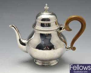 An Edwardian silver teapot, retailed by Harrods. 