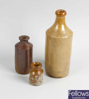 Two boxes containing a large collection of assorted stoneware bottles and jars