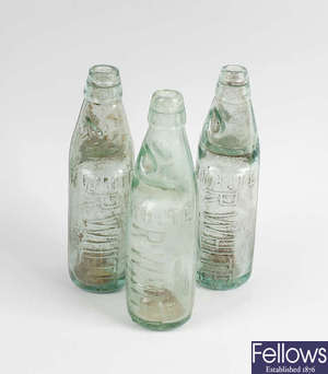 Two boxes containing a large collection of assorted glass bottles