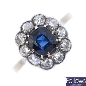 A late 19th century gold and silver sapphire and diamond cluster ring.