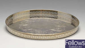 A modern silver tray of circular form.