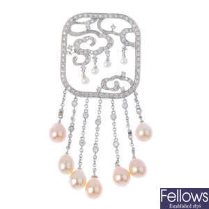 A diamond and cultured pearl pendant.