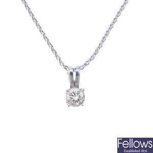 A platinum brilliant-cut diamond single-stone pendant and chain.