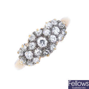 A mid 20th century 18ct gold diamond triple cluster ring. 