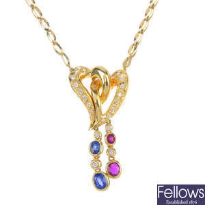 A ruby, sapphire and diamond heart necklace. 
