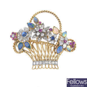 A gem-set and diamond floral brooch. 