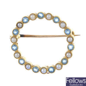 An early 20th century 15ct gold aquamarine and split pearl brooch.
