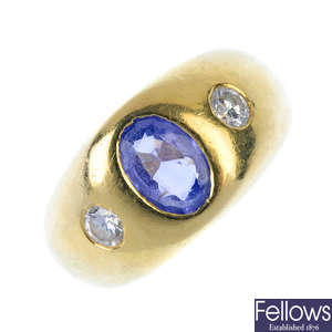 A sapphire and diamond three-stone ring. 