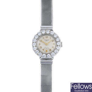 A mid 20th century platinum and 9ct gold diamond cocktail watch. 