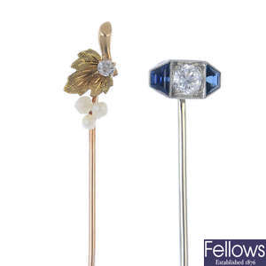 A diamond and sapphire stickpin, together with a pearl grapevine stickpin. 