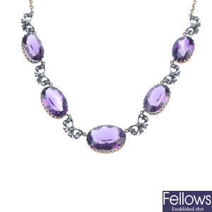 An amethyst and diamond necklace. 