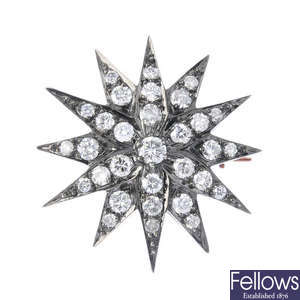 A diamond star brooch. 