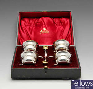 A cased set of four Edwardian silver open salts and spoons. 