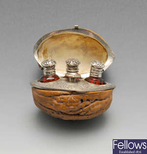 A 19th century French hinged walnut case with scent bottles & funnel.